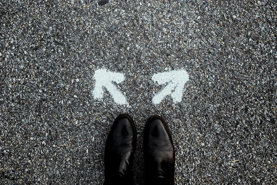 Two arrows pointing different directions at a person's feet l Finding the Right Counselor l Greenville, SC